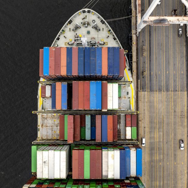 This aerial view shows a cargo ship carrying shipping containers moored to the pier at the Port of Baltimore on April 10, 2025, in Baltimore, Maryland. US President Donald Trump's 10 percent tariff for almost all countries except China will likely remain in place going forward, his top economic advisor Kevin Hassett said Thursday. On April 8, Trump announced a 90-day pause on higher tariffs against all countries except China, reversing a policy that had roiled global stock markets and spooked the American bond markets -- a key barometer of investors' faith in the US government's ability to pay its debts. (Photo by Jim WATSON / AFP)