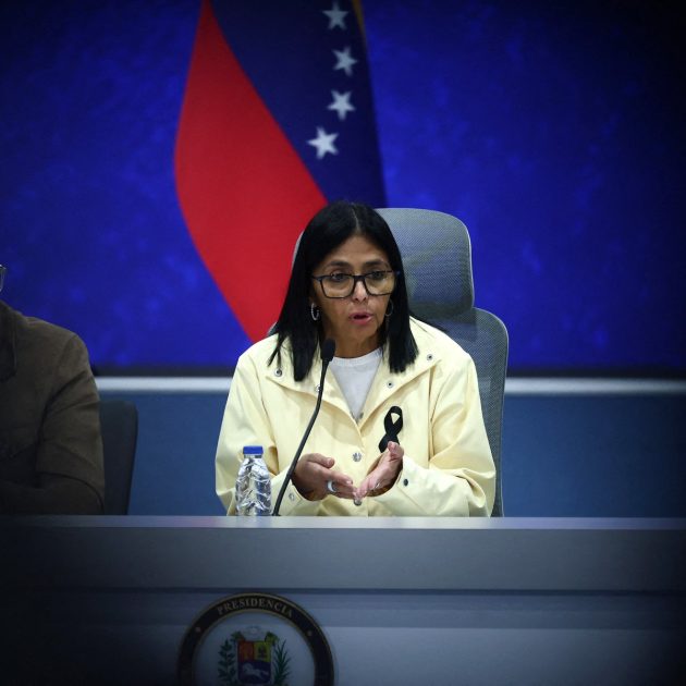 Venezuela's interim President Delcy Rodriguez (C) speaks during a press conference alongside National Assembly President Jorge Rodriguez (L) and Interior Minister Diosdado Cabello (unseen) at the Generalisimo Francisco de Miranda Air Base in Caracas on July 2, 2026. At least 2,595 people have died as a result of the twin earthquakes that struck Venezuela on June 24, interim President Delcy Rodriguez announced on July 2, adding that all of the victims will be properly identified. (Photo by Lucas AGUAYO / AFP)