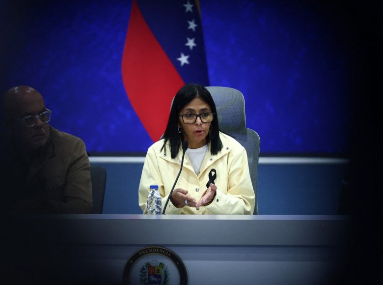 Venezuela's interim President Delcy Rodriguez (C) speaks during a press conference alongside National Assembly President Jorge Rodriguez (L) and Interior Minister Diosdado Cabello (unseen) at the Generalisimo Francisco de Miranda Air Base in Caracas on July 2, 2026. At least 2,595 people have died as a result of the twin earthquakes that struck Venezuela on June 24, interim President Delcy Rodriguez announced on July 2, adding that all of the victims will be properly identified. (Photo by Lucas AGUAYO / AFP)