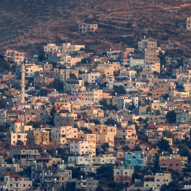 This photograph taken from the outskirts of Nablus shows the Palestinian village of Beit Furik in the north of the Israeli-occupied West Bank on July 23, 2026. Three Palestinians were killed on July 23 after two stabbing attacks in the north of the occupied West Bank, one near an Israeli settlement and another near an army base, the military said. (Photo by Zain JAAFAR / AFP)