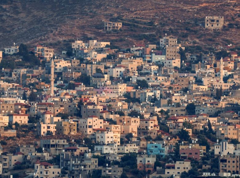 This photograph taken from the outskirts of Nablus shows the Palestinian village of Beit Furik in the north of the Israeli-occupied West Bank on July 23, 2026. Three Palestinians were killed on July 23 after two stabbing attacks in the north of the occupied West Bank, one near an Israeli settlement and another near an army base, the military said. (Photo by Zain JAAFAR / AFP)