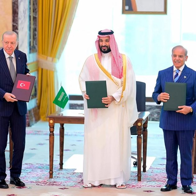 This handout photograph taken and released by Pakistan's Prime Minister's Office on August 7, 2026 shows Saudi Crown Prince Mohammed bin Salman (C), Turkish President Recep Tayyip Erdogan (L) and Pakistani Prime Minister Shehbaz Sharif posing after signing the Mecca Joint Defence Agreement in Mecca, Saudi Arabia. Saudi Arabia, Turkey and Pakistan signed a joint defence agreement on August 7 amid violence in the region from Houthi attacks and the US-Iran war. (Photo by Handout / Pakistan Prime Minister's Office / AFP) / RESTRICTED TO EDITORIAL USE - MANDATORY CREDIT "AFP PHOTO /Pakistan Prime Minister's Office/ HANDOUT / " - NO MARKETING NO ADVERTISING CAMPAIGNS - DISTRIBUTED AS A SERVICE TO CLIENTS
