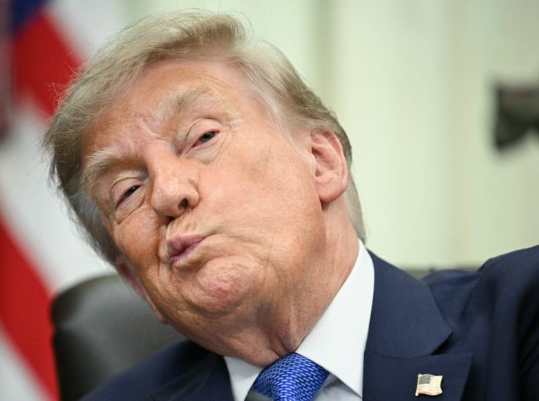 US President Donald Trump looks on before signing an executive order calling for more research and flexibility on vaccines, in the Oval Office of the White House in Washington, DC, on August 10, 2026. Trump signed an executive order Monday pushing for a rethink of school vaccine mandates and repeating calls for the measles-mumps-rubella vaccine to be separated into three individual shots. Curbing vaccines has been a key priority for Health Secretary Robert F. Kennedy Jr, who founded an anti-vaccine nonprofit and has long promoted a disproven link between immunization and autism. (Photo by Jim WATSON / AFP)
