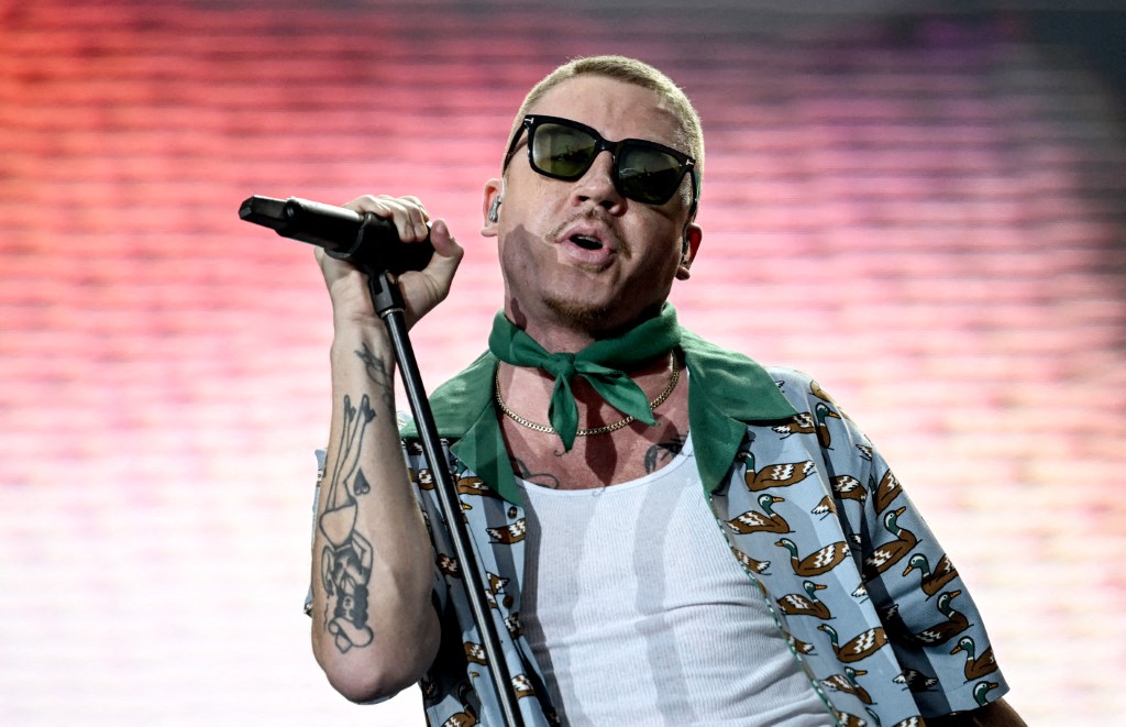 10 September 2023, Berlin: US musician Macklemore performs on stage at the Lollapalooza Festival Berlin on the grounds of the Olympiastadion. Photo: Britta Pedersen/dpa (Photo by BRITTA PEDERSEN / dpa Picture-Alliance via AFP)