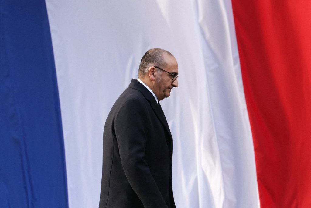 France's Interior Minister Laurent Nunez looks down in front of the French flag during the installation ceremony of the new Paris Police Prefect, in Paris, on October 27, 2025. (Photo by Thomas SAMSON / AFP)