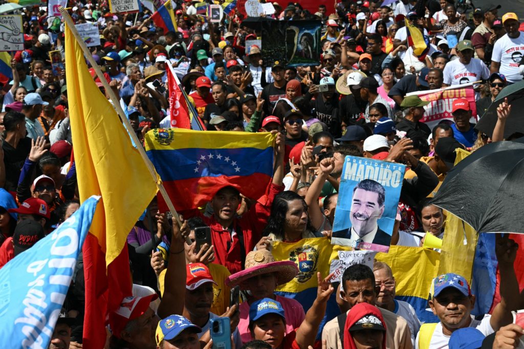 Demonstrators attend a rally in support of ousted President Nicolas Maduro in Caracas on January 7, 2026. US Energy Secretary Chris Wright said in January 7, Washington will control sales of Venezuelan oil "indefinitely," a day after President Donald Trump announced Venezuela's interim leaders had agreed to US-managed marketing of 30-50 million barrels of crude. (Photo by RONALDO SCHEMIDT / AFP)