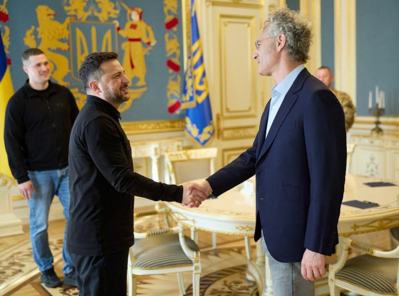 This handout photograph taken and released by the Ukrainian Presidential Press Service on May 12, 2026, shows Ukraine's President Volodymyr Zelensky and CEO of AI firm Palantir Alex Karp shaking hands during their meeting in Kyiv, amid the Russian invasion of Ukraine. (Photo by Handout / UKRAINIAN PRESIDENTIAL PRESS SERVICE / AFP) / XGTY / RESTRICTED TO EDITORIAL USE - MANDATORY CREDIT "AFP PHOTO / UKRAINIAN PRESIDENTIAL PRESS SERVICE" - NO MARKETING NO ADVERTISING CAMPAIGNS - DISTRIBUTED AS A SERVICE TO CLIENTS