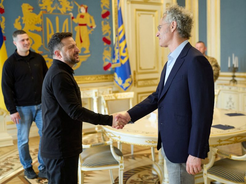 This handout photograph taken and released by the Ukrainian Presidential Press Service on May 12, 2026, shows Ukraine's President Volodymyr Zelensky and CEO of AI firm Palantir Alex Karp shaking hands during their meeting in Kyiv, amid the Russian invasion of Ukraine. (Photo by Handout / UKRAINIAN PRESIDENTIAL PRESS SERVICE / AFP) / XGTY / RESTRICTED TO EDITORIAL USE - MANDATORY CREDIT "AFP PHOTO / UKRAINIAN PRESIDENTIAL PRESS SERVICE" - NO MARKETING NO ADVERTISING CAMPAIGNS - DISTRIBUTED AS A SERVICE TO CLIENTS