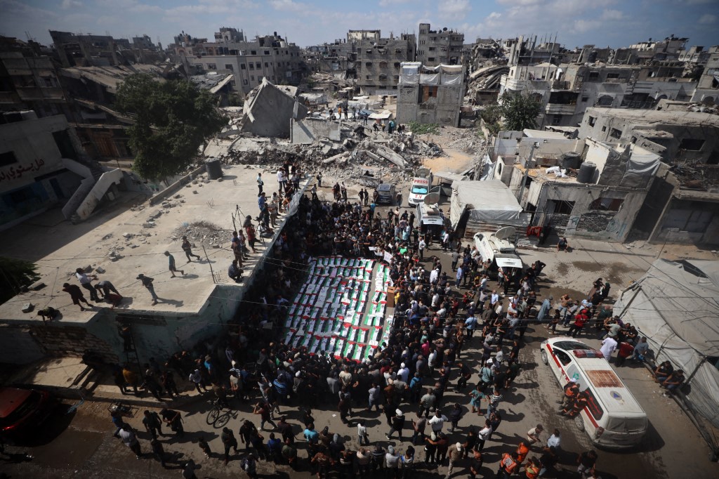Palestinians attend the mass funeral for members of the Irahem, Malaka, Qanbour, Balawi and Dahdouh families, who were killed in an Israeli strike in 2023 and whose remains were recovered from beneath the rubble, according to Gaza's Civil Defense, in Gaza City, on September 6, 2026. (Photo by Majdi Fathi/NurPhoto) (Photo by MAJDI FATHI / NurPhoto via AFP)