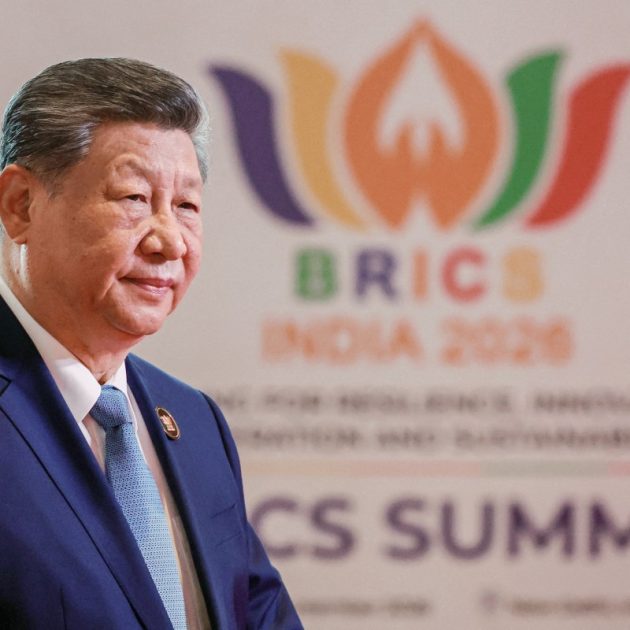 In this pool photograph distributed by the Russian state agency Sputnik, China's President Xi Jinping arrives before the start of the 18th BRICS Summit in New Delhi on September 12, 2026. (Photo by Alexander KAZAKOV / POOL / AFP)