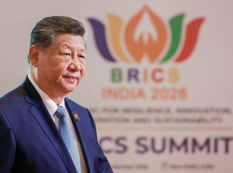 In this pool photograph distributed by the Russian state agency Sputnik, China's President Xi Jinping arrives before the start of the 18th BRICS Summit in New Delhi on September 12, 2026. (Photo by Alexander KAZAKOV / POOL / AFP)