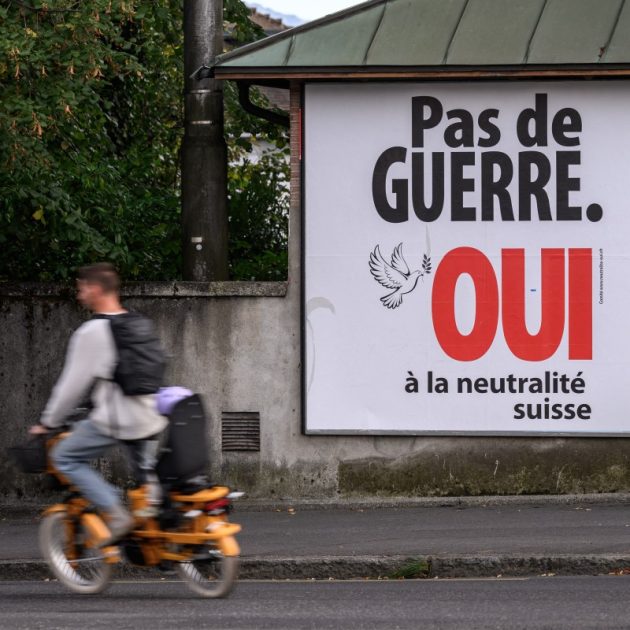 An electoral poster reads "No war, Yes to Swiss neutrality" on a street of Lausanne, western Switzerland on September 19, 2026. On September 27, 2026, Swiss citizens will vote on a popular initiative seeking to enshrine Switzerlands perpetual and armed neutrality in the Federal Constitution and limit participation in military alliances and sanctions against belligerent states. (Photo by Fabrice COFFRINI / AFP)