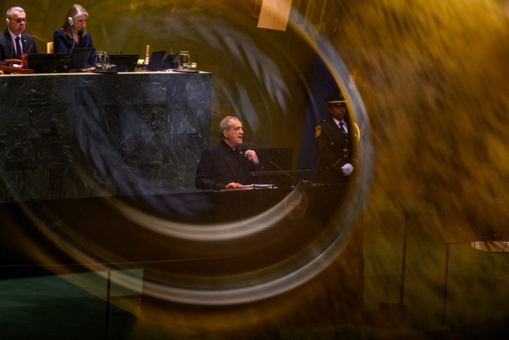 NEW YORK, NEW YORK - SEPTEMBER 23:  (EDITOR'S NOTE: Image was captured in camera using a reflection on a mobile device) President of Iran Masoud Pezeshkian speaks during the 81st session of the United Nations (U.N.) General Assembly at U.N. Headquarters on September 23, 2026 in New York City. World leaders have gathered in New York for the annual session of the United Nations General Assembly, with this year's global issues ranging from the threat of artificial intelligence to the continued wars in Ukraine, Iran and Gaza. Alexi J. Rosenfeld/Getty Images/AFP (Photo by Alexi J. Rosenfeld / GETTY IMAGES NORTH AMERICA / Getty Images via AFP)